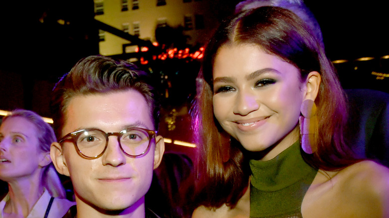 Tom Holland and Zendaya posing 