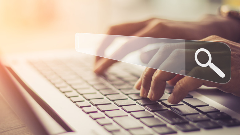 person typing on laptop