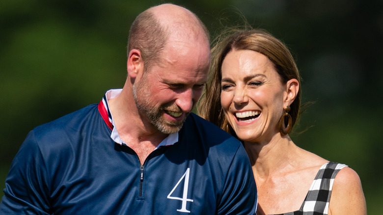 Prince William and Princess Catherine smiling and laughing.