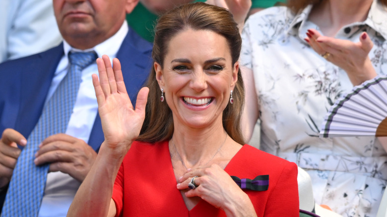 Princess Catherine smiling and waving.