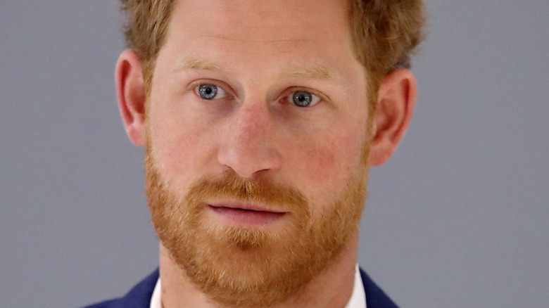 Prince Harry looks pensive at an event