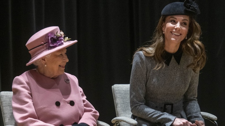 Queen Elizabeth II smiling at Kate Middleton