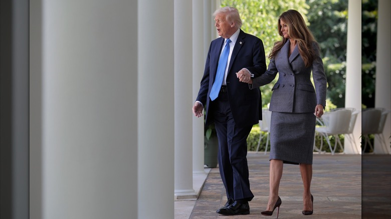President Donald Trump and first lady Melania Trump arrive at the signing ceremony for the TAKE IT DOWN Act in the Rose Garden of the White House on May 19, 2025 in Washington, DC (2025)