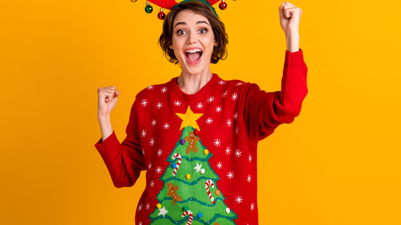 Woman in ugly Christmas sweater
