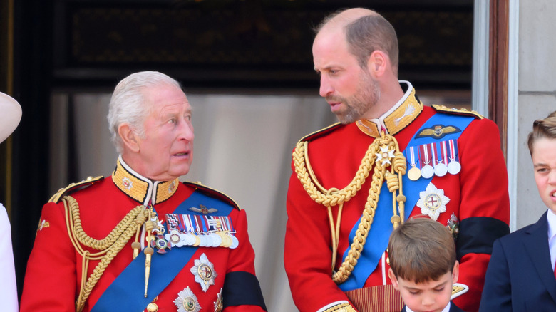 Prince William talking to King Charles III