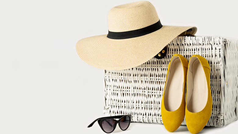 Straw hat, yellow flats, and black sunglasses