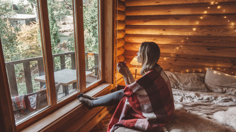 Woman in a cozy bedroom