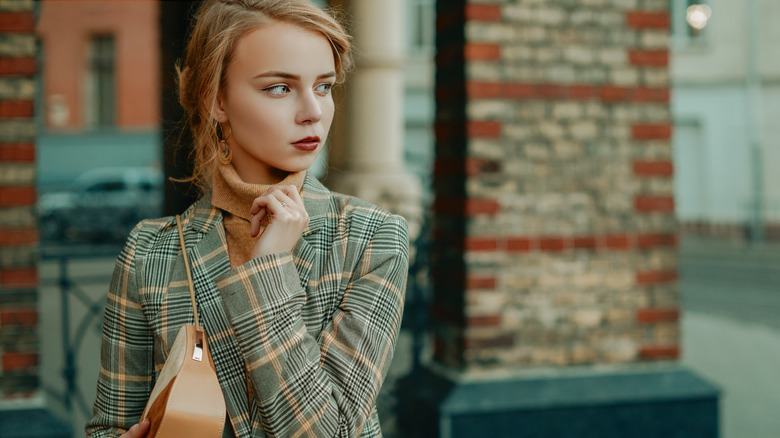 Woman with plaid blazer and turtleneck