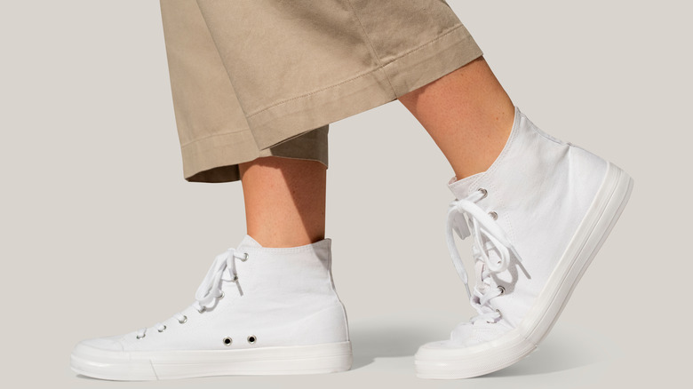 Khaki pants and white sneakers