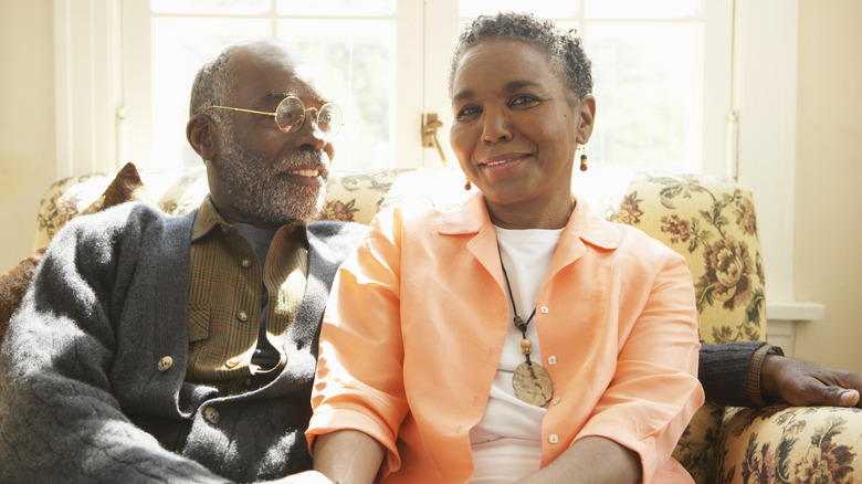 Older couple smiles at each other