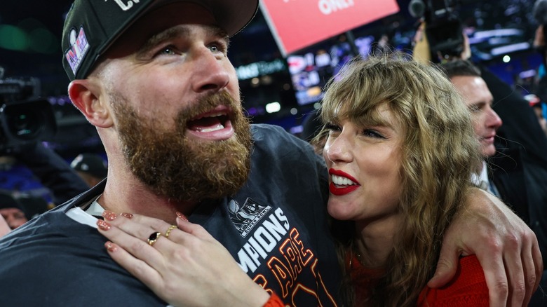 Travis Kelce hugging Taylor Swift