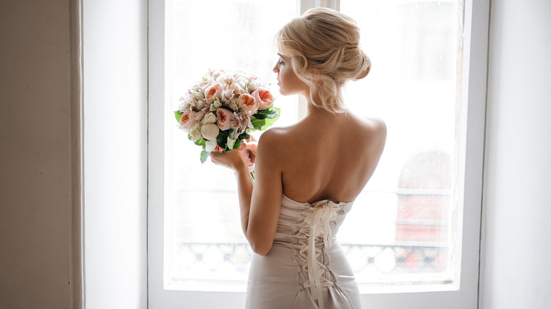 A bride poses on her wedding day