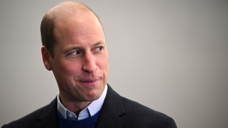 Prince William with a coy, cheeky look