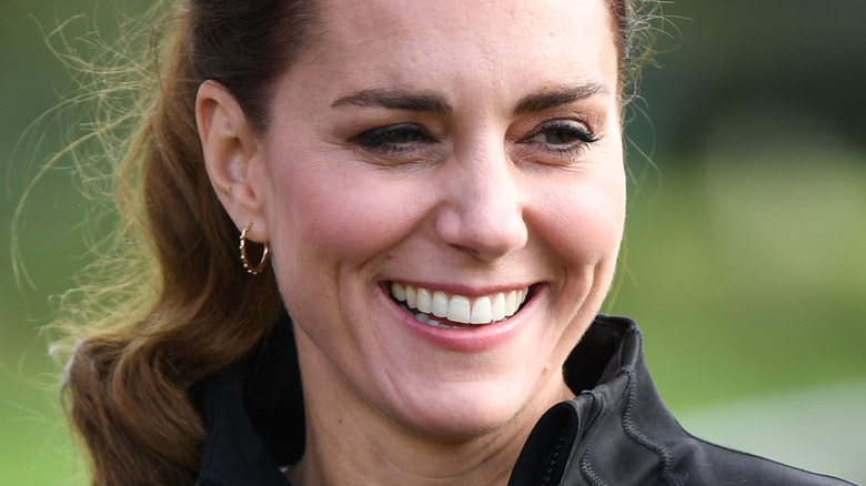 Kate Middleton smiles at an event