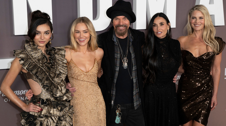 Paulina Chavez, Michelle Randolph, Billy Bob Thornton, Demi Moore, and Ali Larter in front of a 'Landman' backdrop