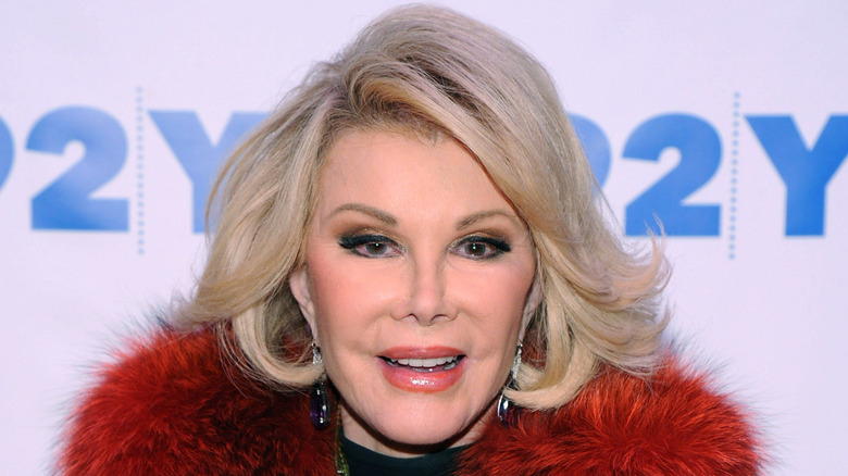 Joan Rivers in red fur collar