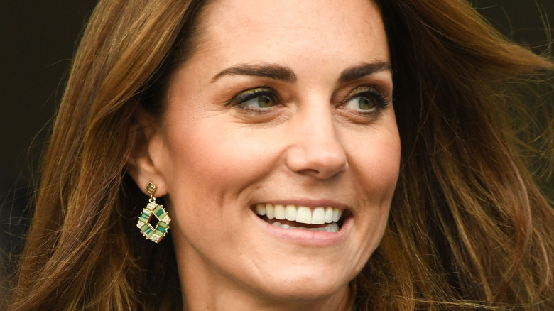 Kate Middleton smiling and looking back