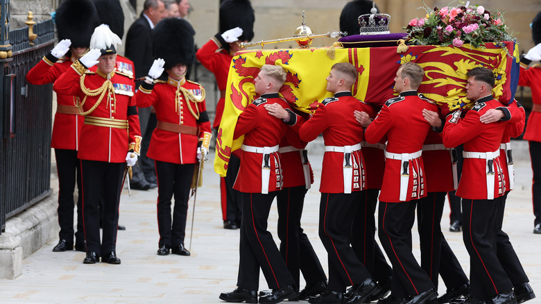 Pallbearers carrying the queen's coffin