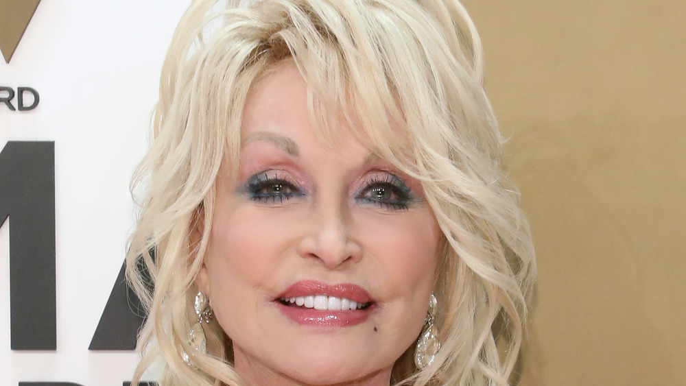 Dolly Parton posing on red carpet
