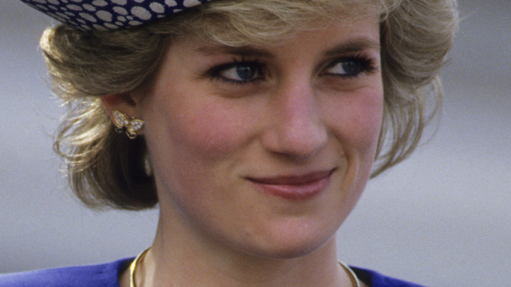 Princess Diana smiling in blue