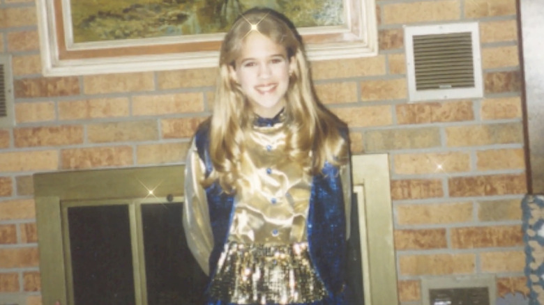 Young Carrie Underwood wearking a sparkling costume as a child