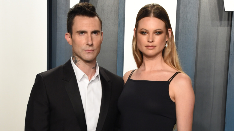 Adam Levine (L) and Behati Prinsloo attend the 2020 Vanity Fair Oscar Party hosted by Radhika Jones at Wallis Annenberg Center for the Performing Arts on February 09, 2020 in Beverly Hills, California.