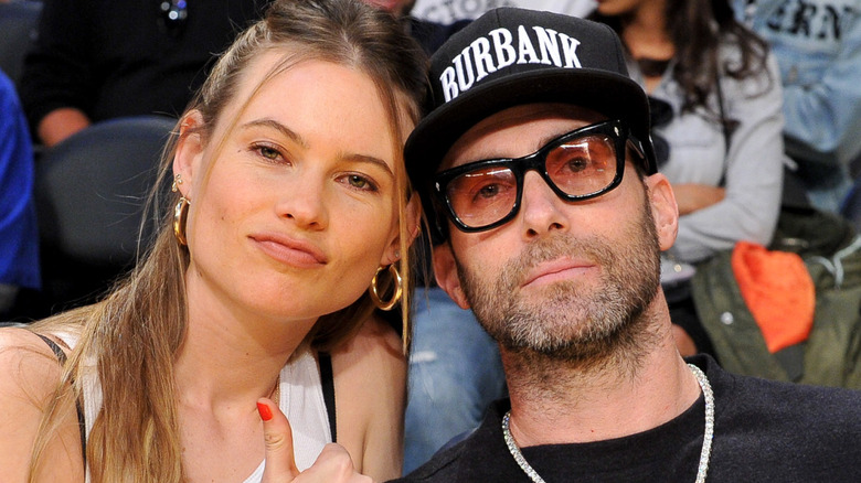 Model Behati Prinsloo and Adam Levine attend a basketball game between the Los Angeles Lakers and the Phoenix Suns at Staples Center on December 02, 2018 in Los Angeles, California.