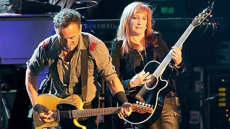 Bruce Springsteen and Patti Scialfa performing on stage