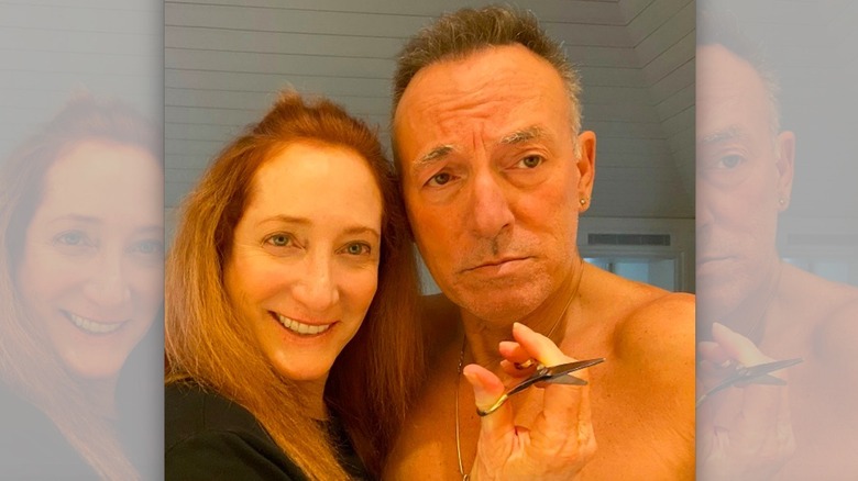 Patti Scialfa giving Bruce Springsteen a haircut