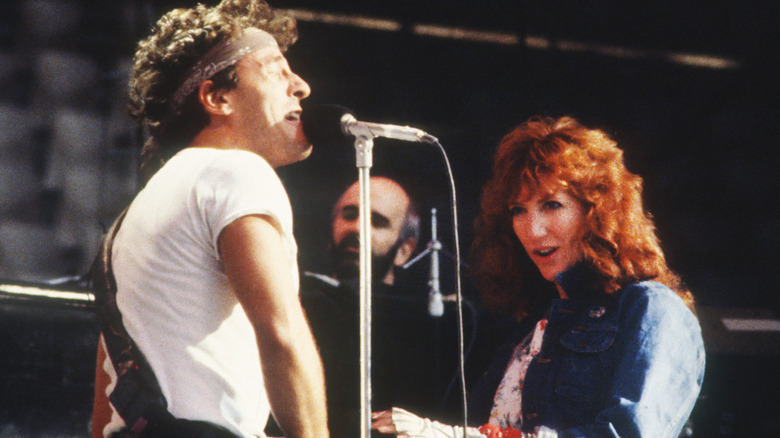 Bruce Springsteen and Patti Scialfa onstage singing