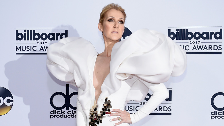 Céline Dion striking a dramatic pose