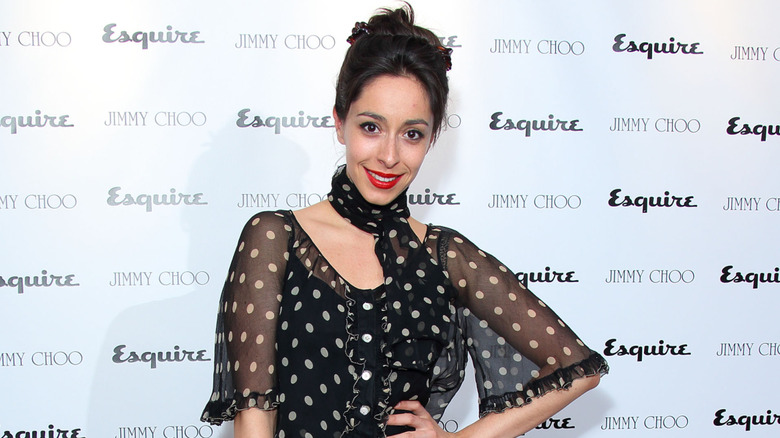 Oona Chaplin posing on step-and-repeat