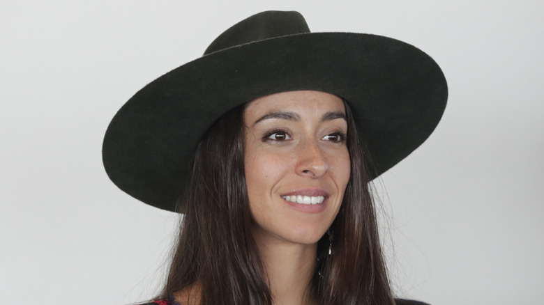 Oona Chaplin wearing a wide-brimmed hat