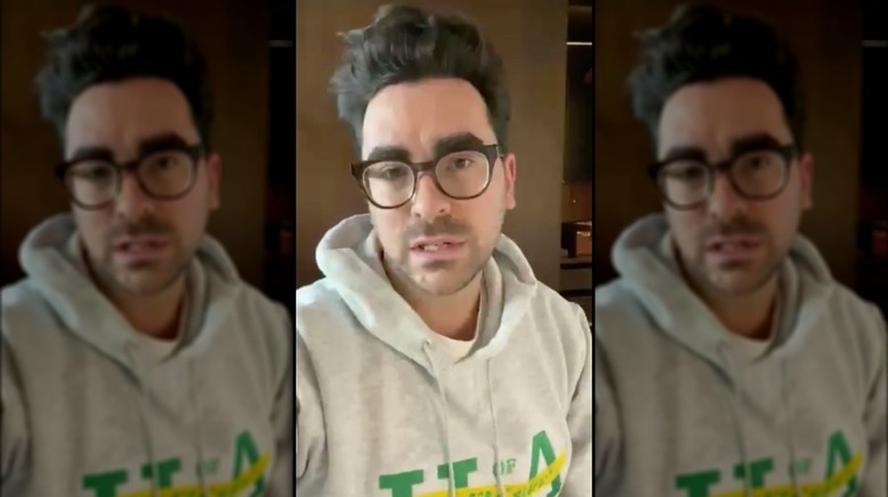 Dan Levy wearing a U of A hoodie