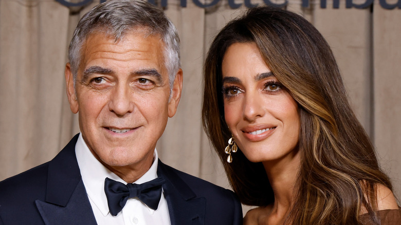 George and Amal Clooney posingfor a photo