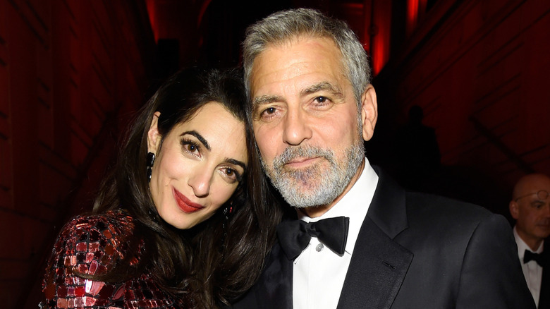 Amal and George Clooney posing for a photo