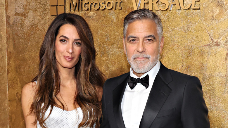 Amal and George Clooney posing for a photo