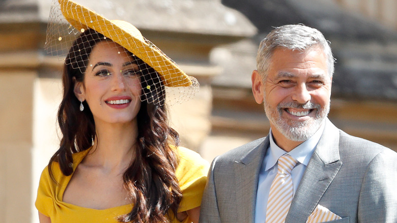 Amal and George Clooney walking together