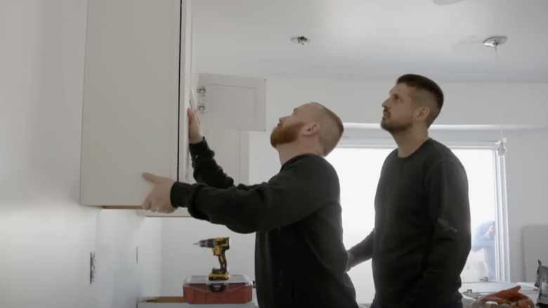 Keith Bynum & Evan Thomas installing cabinetry