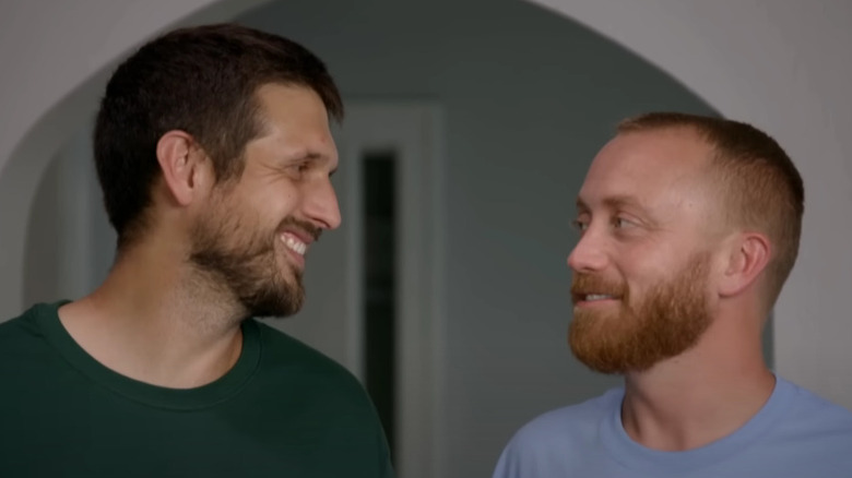 Evan Thomas and Keith Bynum smiling at each other
