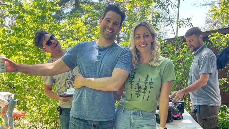 Scott McGillivray and Debra Salmoni posing on set