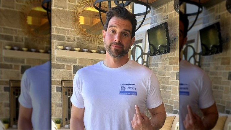 Scott McGillivray pointing at his shirt logo