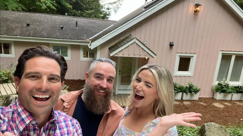 Scott McGillivray poses with two clients on his show Vacation House Rules