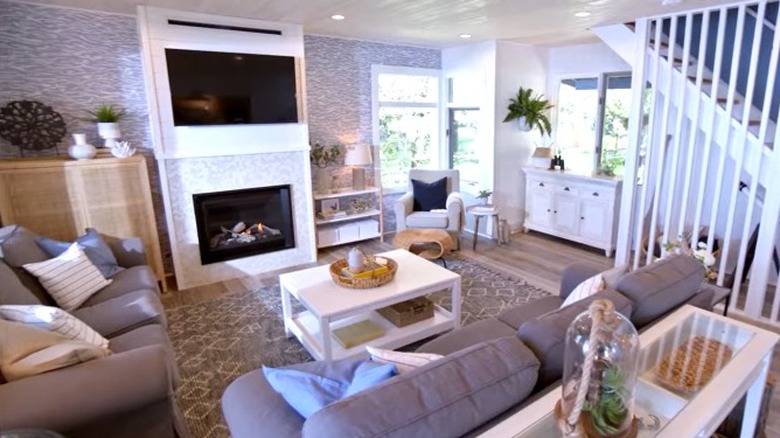 Wallpaper surrounding fireplace in an episode of Vacation House Rules