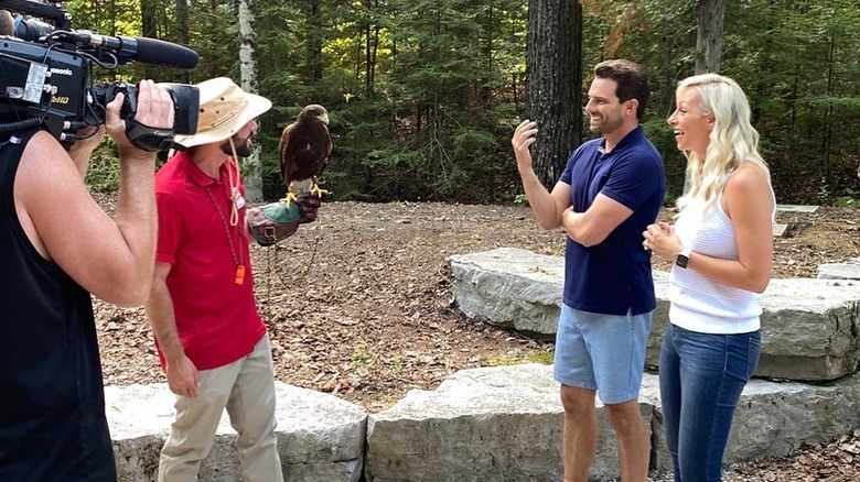 Vacation House Rules stars filming while filming with a bird handler
