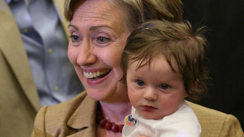 Hillary Clinton with a baby