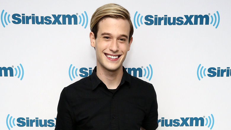 Tyler Henry smiling at an event