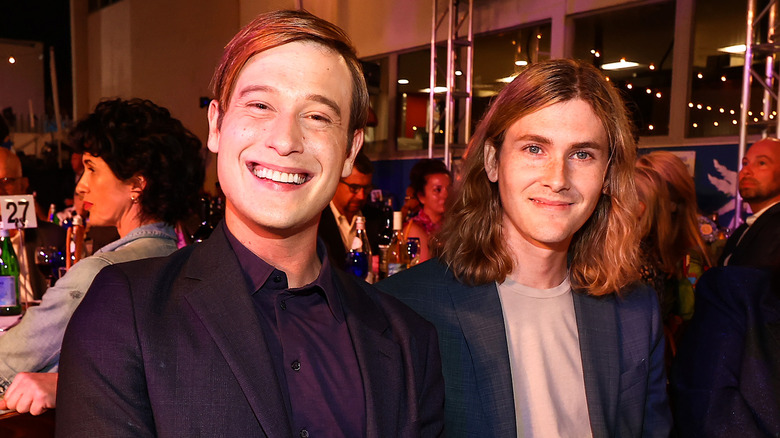 Tyler Henry abd Clint Godwin smiling at dinner event