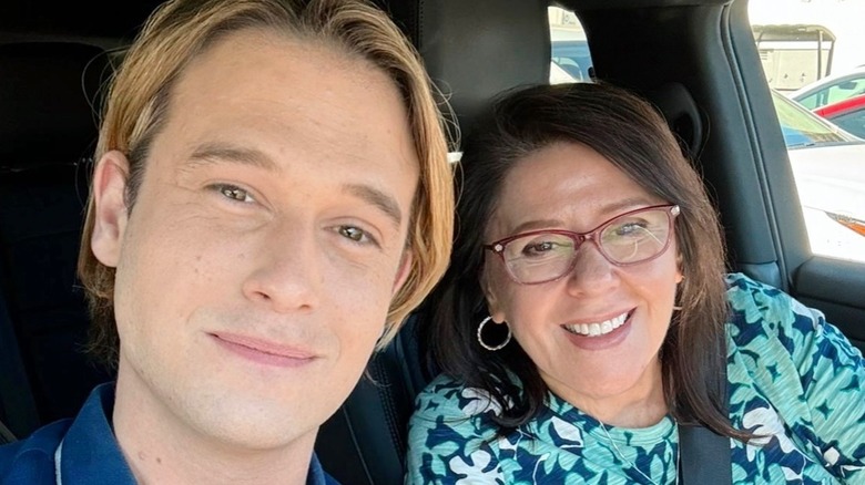 Tyler takes a selfie with his mom inside a car