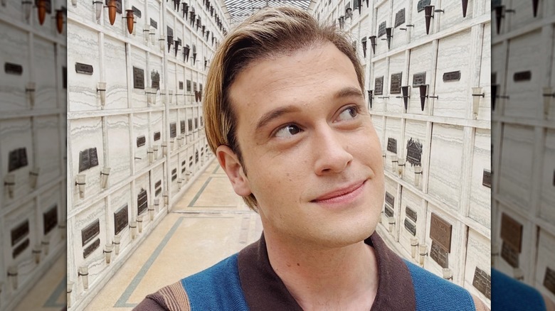 Tyler Henry takes a selfie inside a cemetery